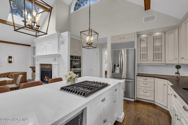 1570 Beaver Hollow Dr, Toms River, NJ 08755 - kitchen featuring an inviting chandelier, appliances with stainless steel finishes, high vaulted ceiling, and visible vents