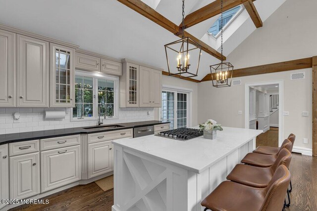 1570 Beaver Hollow Dr, Toms River, NJ 08755 - kitchen featuring decorative backsplash, a sink, dark wood-style floors, a chandelier, and stainless steel appliances