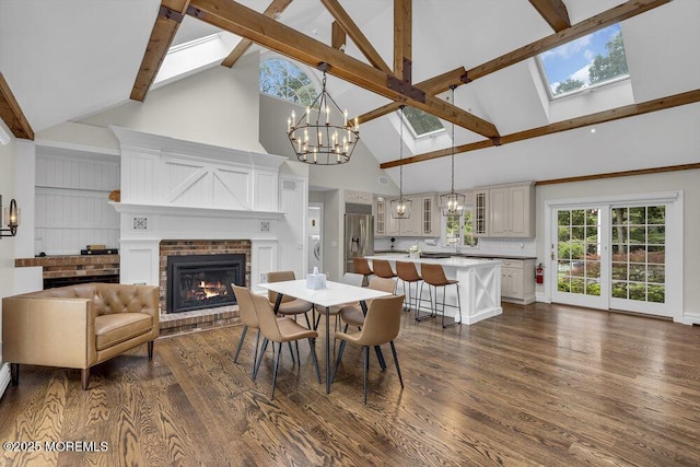 1570 Beaver Hollow Dr, Toms River, NJ 08755 - dining room with an inviting chandelier, a fireplace, beamed ceiling, high vaulted ceiling, and dark wood-type flooring