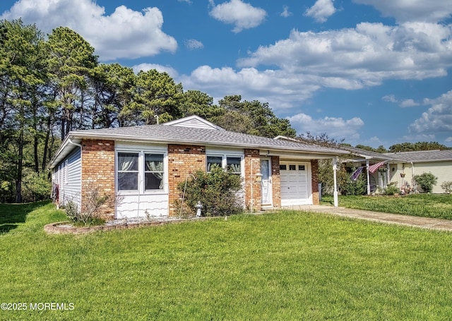 3 Tudor Ct, Brick, NJ 08723 - view of front of home with an attached garage, a front yard, brick siding, and concrete driveway