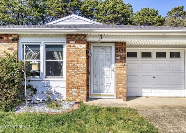 3 Tudor Ct, Brick, NJ 08723 - doorway to property with brick siding, a garage, roof with shingles, and driveway