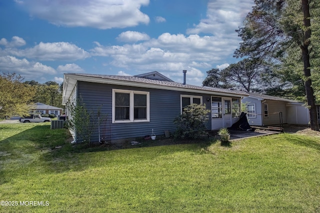 3 Tudor Ct, Brick, NJ 08723 - rear view of house featuring a lawn and cooling unit
