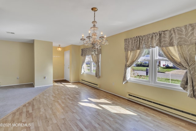 3 Tudor Ct, Brick, NJ 08723 - unfurnished dining area featuring a baseboard heating unit, an inviting chandelier, visible vents, and wood finished floors
