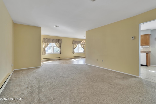 3 Tudor Ct, Brick, NJ 08723 - spare room with an inviting chandelier, a baseboard heating unit, and visible vents