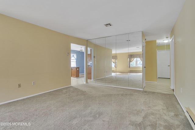 3 Tudor Ct, Brick, NJ 08723 - empty room with light colored carpet, a baseboard radiator, baseboards, and visible vents