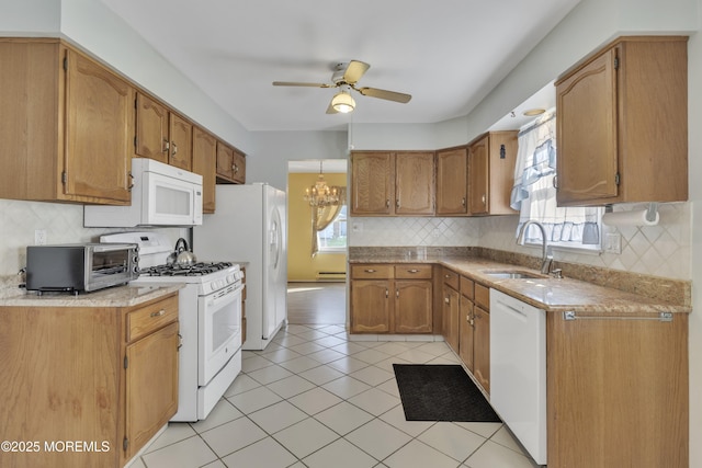 3 Tudor Ct, Brick, NJ 08723 - kitchen with a sink, ceiling fan with notable chandelier, a healthy amount of sunlight, and white appliances