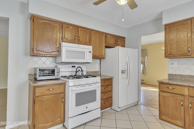 3 Tudor Ct, Brick, NJ 08723 - kitchen featuring a toaster, white appliances, tasteful backsplash, a ceiling fan, and light tile patterned floors