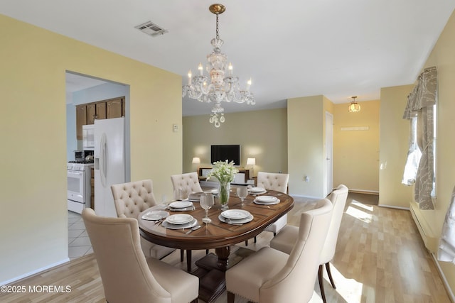 3 Tudor Ct, Brick, NJ 08723 - dining area featuring a chandelier, baseboards, light wood-type flooring, a baseboard radiator, and visible vents