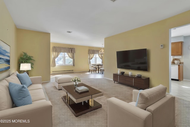 3 Tudor Ct, Brick, NJ 08723 - living area with an inviting chandelier, baseboards, baseboard heating, and visible vents