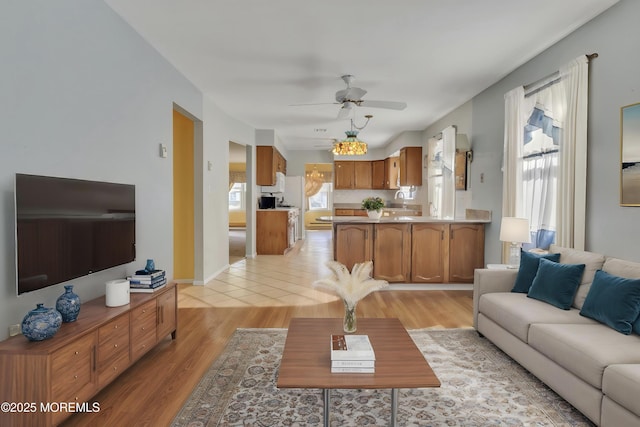 3 Tudor Ct, Brick, NJ 08723 - living area featuring light wood-style floors and ceiling fan