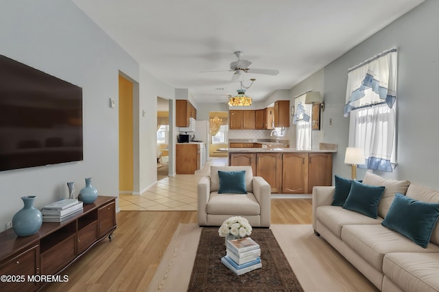 3 Tudor Ct, Brick, NJ 08723 - living area with a ceiling fan and light wood-style flooring