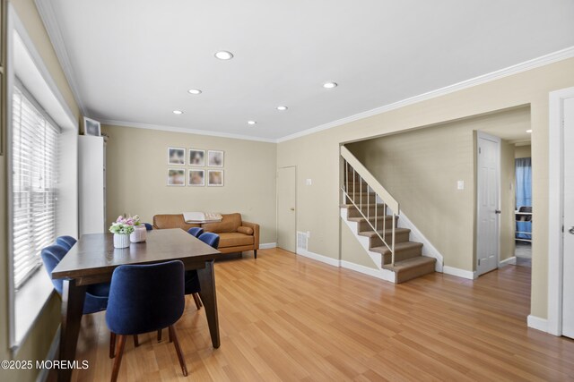 162 Tudor Ct, Lakewood, NJ 08701 - dining area with crown molding, stairs, baseboards, light wood finished floors, and recessed lighting