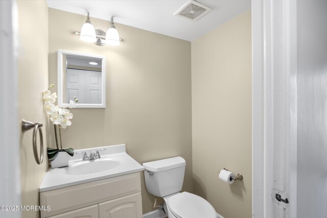 162 Tudor Ct, Lakewood, NJ 08701 - half bathroom featuring toilet, visible vents, and vanity