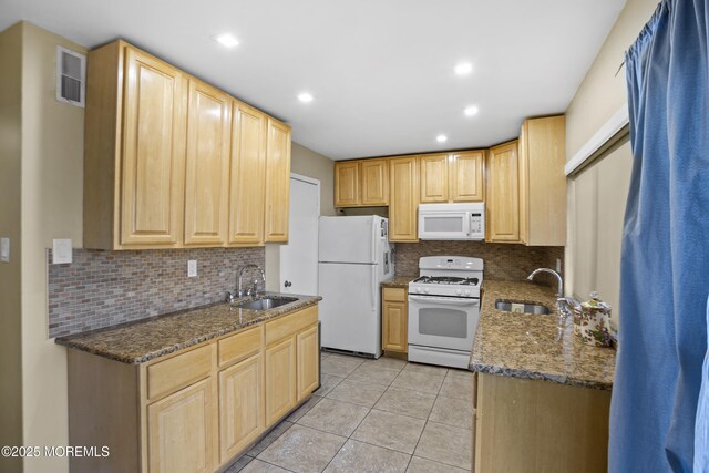 162 Tudor Ct, Lakewood, NJ 08701 - kitchen with a sink, light brown cabinets, backsplash, and white appliances