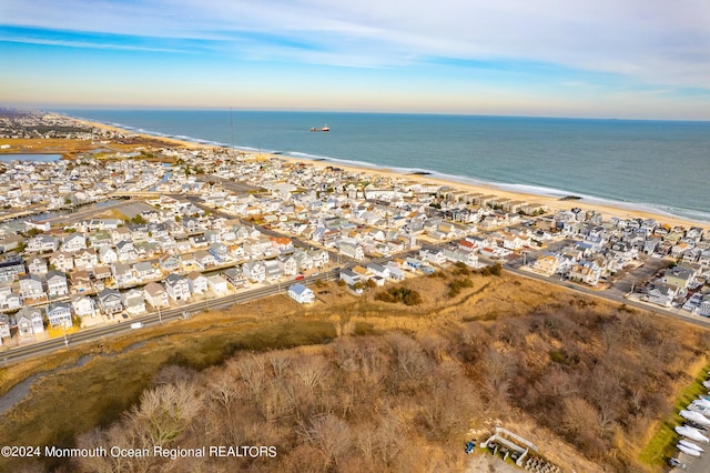 bird's eye view with a residential view, a beach view, and a water view