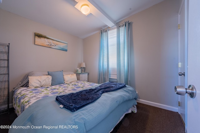 carpeted bedroom featuring baseboards