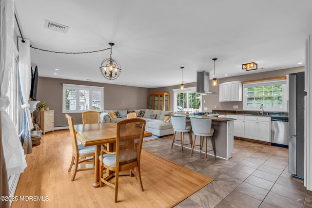 dining room featuring recessed lighting and a chandelier