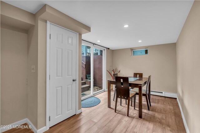 dining area with light wood-type flooring, baseboards, recessed lighting, and baseboard heating
