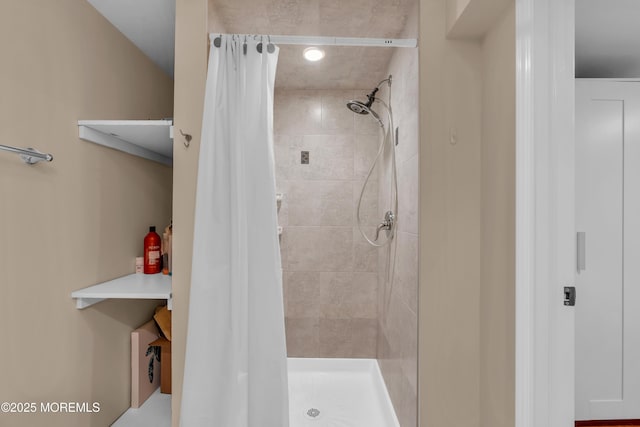 bathroom featuring a shower stall