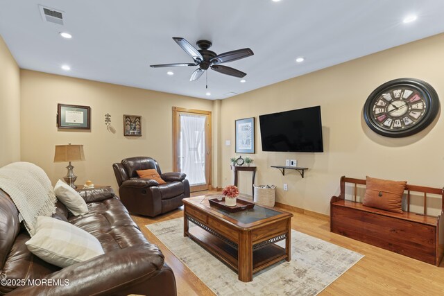 living room featuring ceiling fan, recessed lighting, wood finished floors, and visible vents