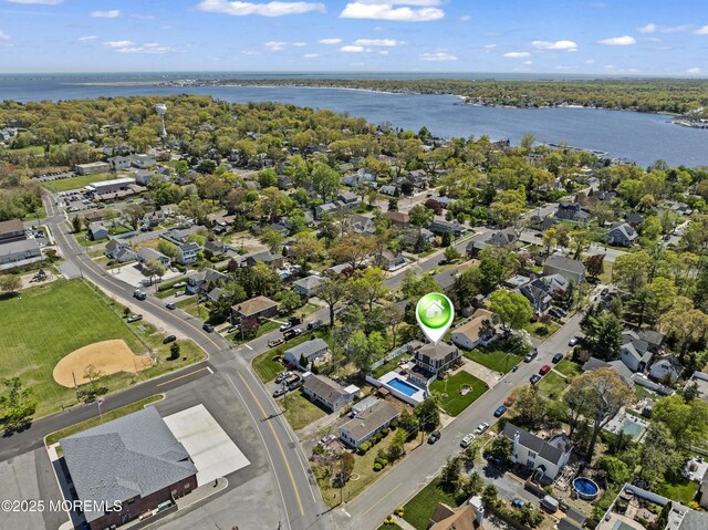 bird's eye view with a residential view and a water view
