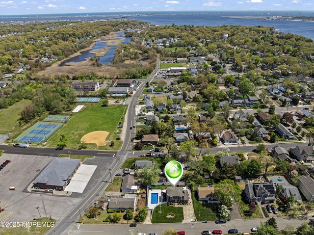 aerial view with a water view and a residential view