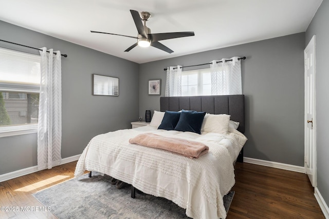 bedroom with baseboards, ceiling fan, and wood finished floors