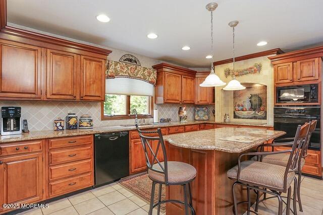 65 Devonshire Dr, Morganville, NJ 07751 - kitchen with decorative backsplash, brown cabinetry, black appliances, and a kitchen bar
