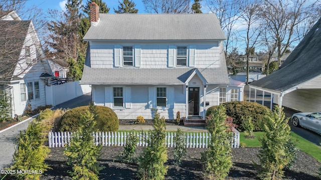 191 State Route 35, Red Bank, NJ 07701 - view of front facade with fence private yard, roof with shingles, a chimney, and a carport