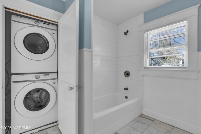 191 State Route 35, Red Bank, NJ 07701 - bathroom featuring baseboards, tub / shower combination, stacked washer / dryer, and marble finish floor