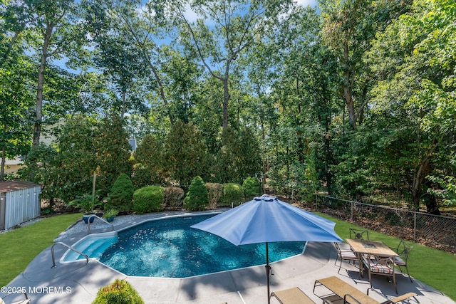 view of pool with fence, a fenced in pool, a patio, and a yard