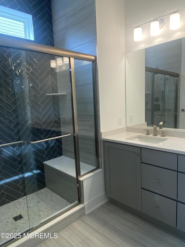103 Wisteria Ct, Freehold, NJ 07728 - full bath featuring vanity, a stall shower, and wood finished floors