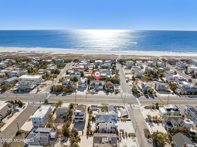 bird's eye view with a beach view, a residential view, and a water view