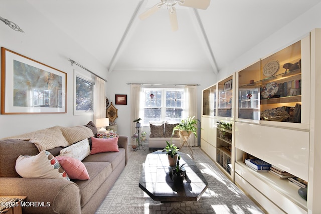 carpeted living room featuring a ceiling fan and vaulted ceiling with beams
