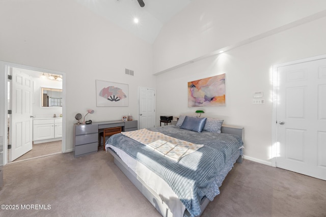bedroom with light colored carpet, baseboards, visible vents, and high vaulted ceiling