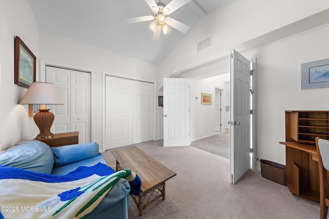 living area with light colored carpet, ceiling fan, visible vents, and lofted ceiling