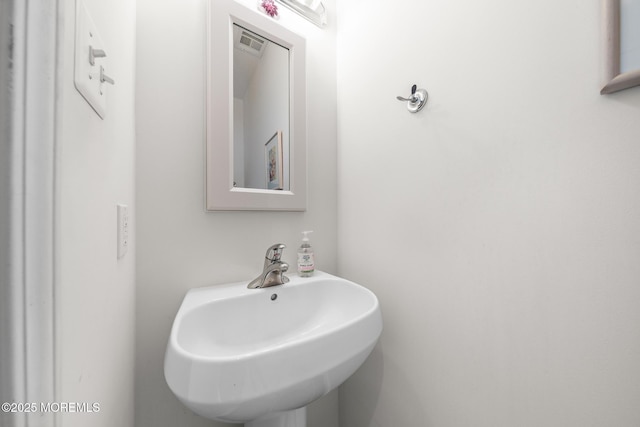 bathroom featuring a sink and visible vents