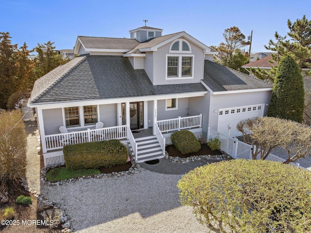 view of front of house with fence, covered porch, an attached garage, and a shingled roof