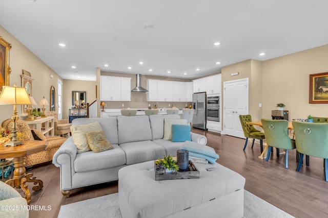 living area with recessed lighting and wood finished floors