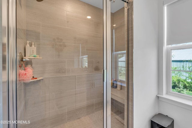 full bath featuring a shower stall