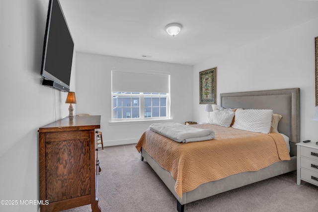 carpeted bedroom with baseboards