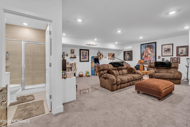living area featuring carpet flooring and recessed lighting