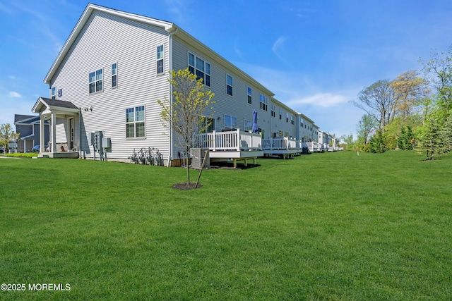 back of property with a lawn