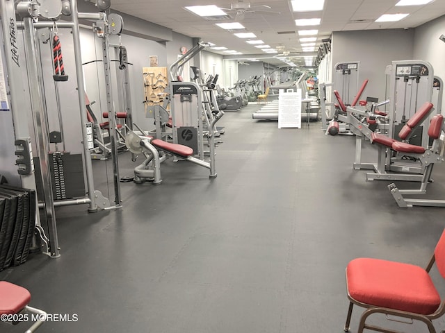 gym featuring a drop ceiling