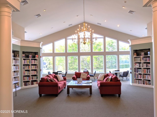 living area with carpet flooring, a healthy amount of sunlight, and built in shelves