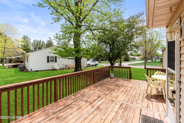 deck featuring a yard