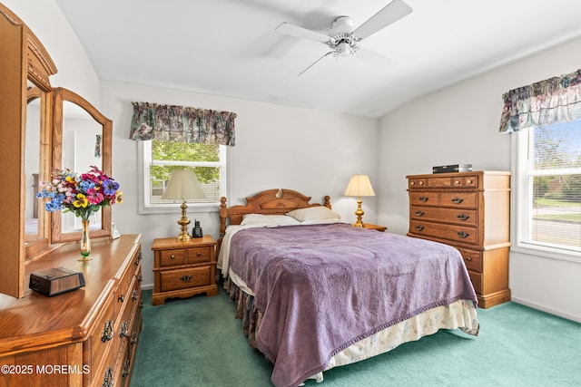 bedroom featuring baseboards, a ceiling fan, and dark carpet