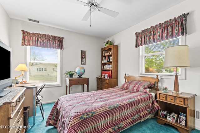 bedroom featuring carpet floors, a ceiling fan, and visible vents