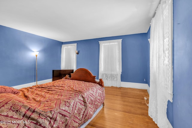 125 W Main St, Freehold, NJ 07728 - bedroom featuring baseboards and wood finished floors