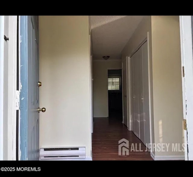 655 Yale Way Unit A, Monroe, NJ 08831 - hallway featuring baseboard heating, wood finished floors, and baseboards